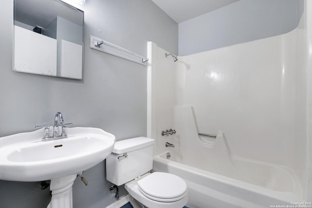 full bathroom with bathtub / shower combination, toilet, and sink