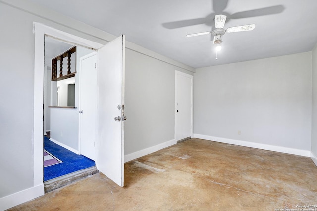 empty room featuring concrete flooring and ceiling fan