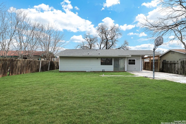 back of house featuring a yard and a patio area