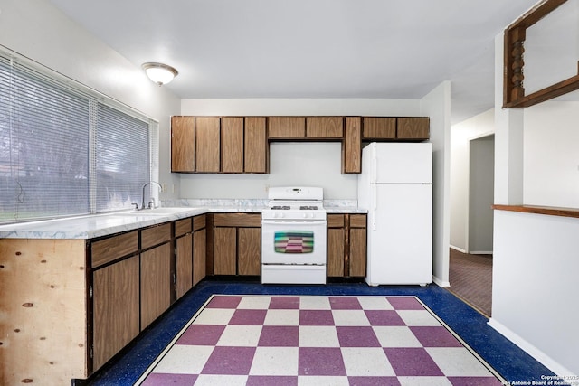 kitchen with white appliances and sink