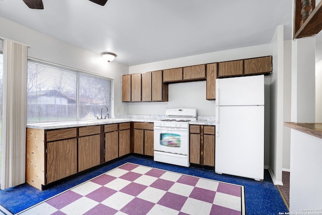 kitchen with sink and white appliances