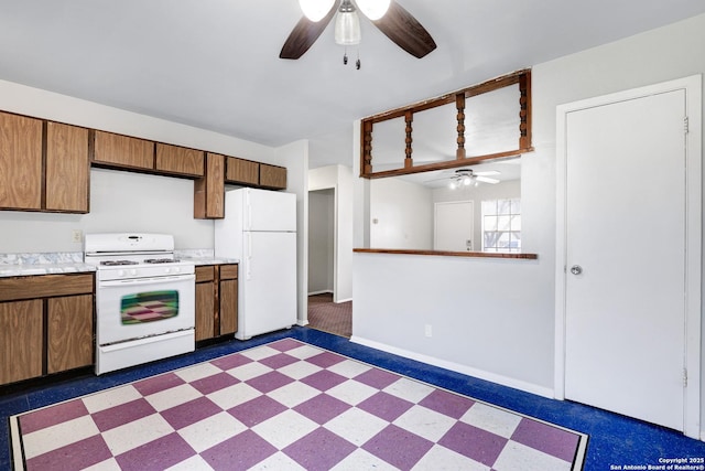 kitchen with white appliances and ceiling fan