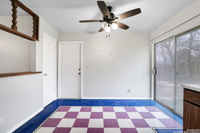 interior space with ceiling fan