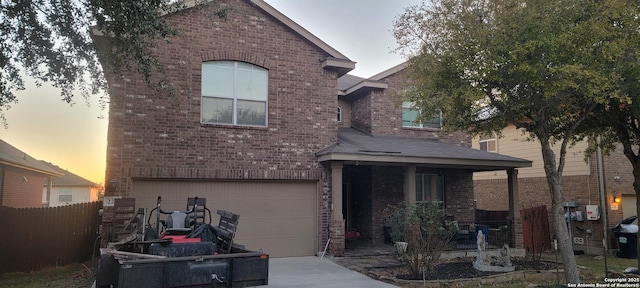 view of front facade featuring a garage and a porch