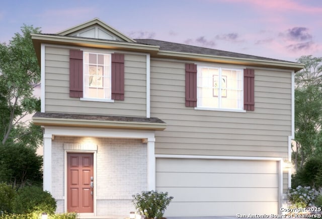 view of front of home with a garage