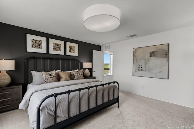 bedroom featuring light colored carpet