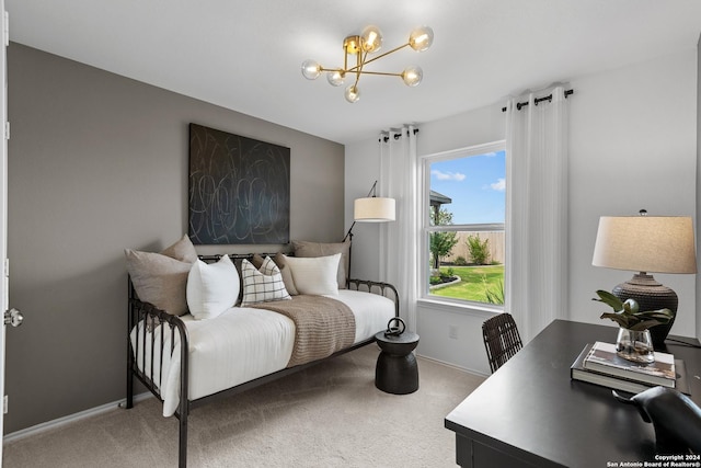 carpeted bedroom with an inviting chandelier