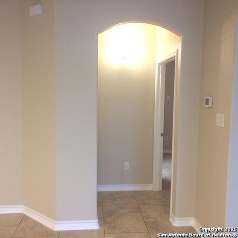 hallway with light tile patterned flooring