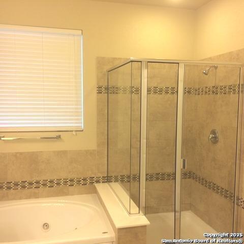 bathroom with independent shower and bath