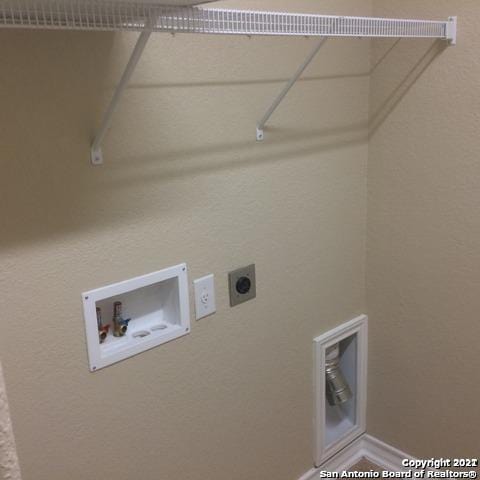 laundry area with hookup for an electric dryer and hookup for a washing machine