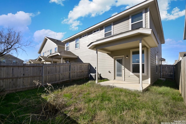 back of house with a patio area