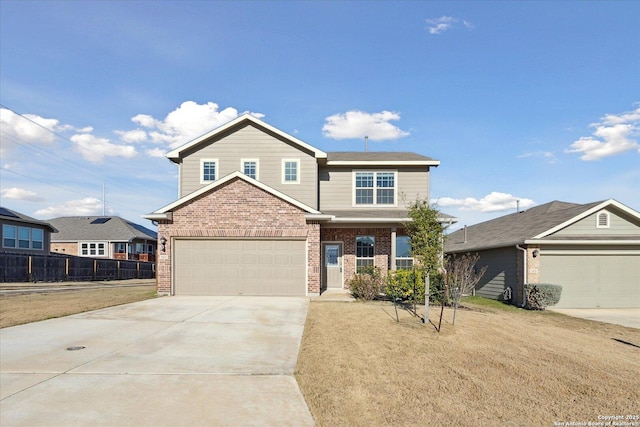 view of front of property featuring a garage and a front yard