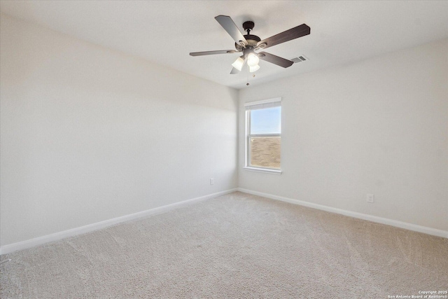 empty room with ceiling fan and carpet flooring