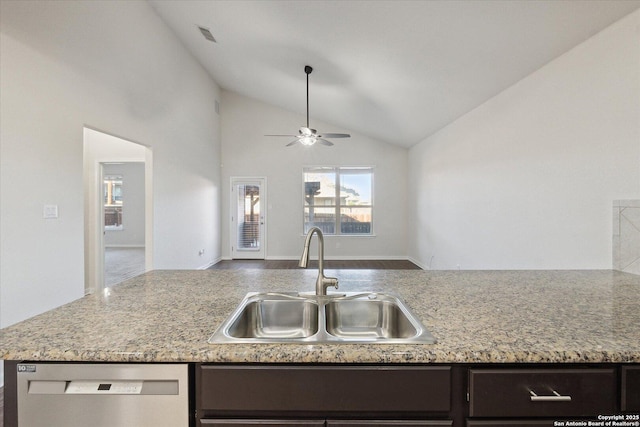 kitchen with vaulted ceiling, dishwasher, sink, dark brown cabinetry, and ceiling fan