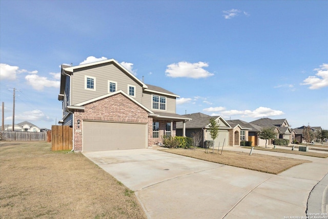 view of front of home with a garage and a front lawn