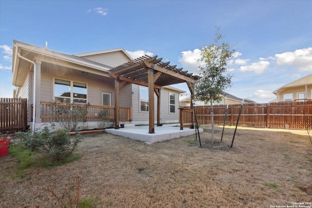 back of property featuring a pergola and a patio area