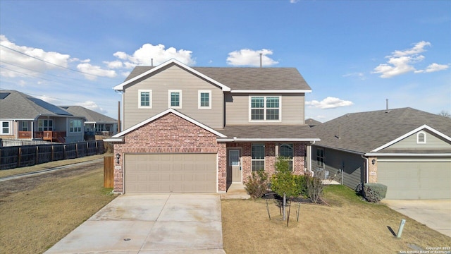 view of front of property with a garage and a front yard