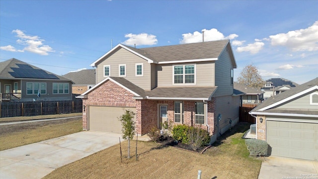 view of front facade featuring a garage and a front yard