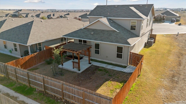 rear view of house with a patio area and central air condition unit