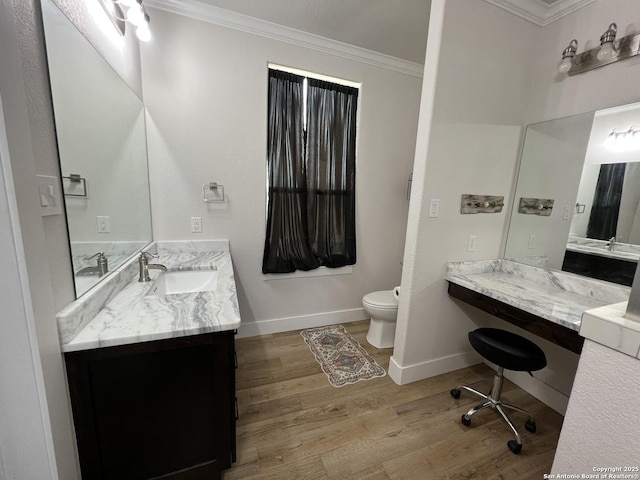 bathroom featuring crown molding, wood-type flooring, toilet, and vanity