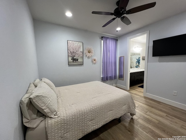 bedroom featuring hardwood / wood-style flooring, ceiling fan, and ensuite bathroom