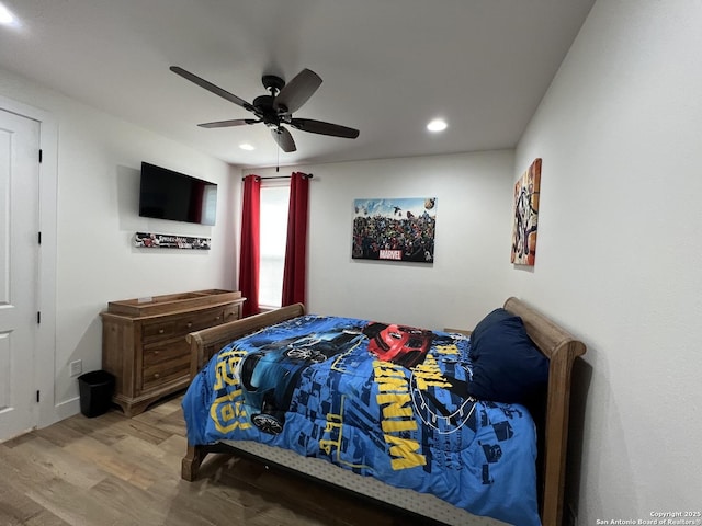 bedroom featuring hardwood / wood-style flooring and ceiling fan