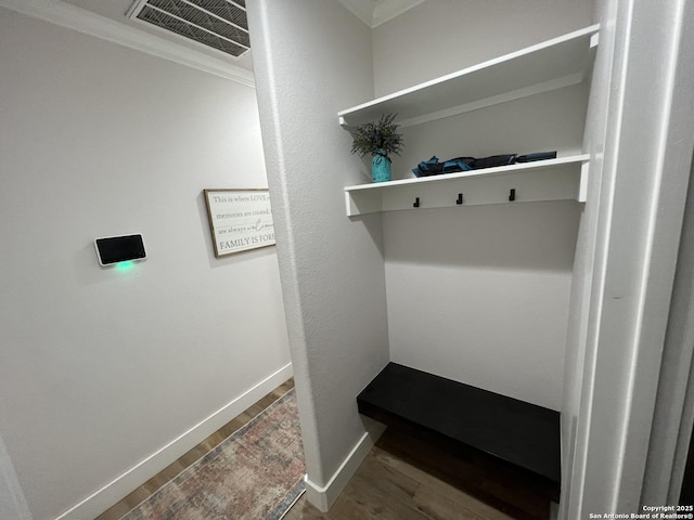 mudroom featuring crown molding and hardwood / wood-style floors