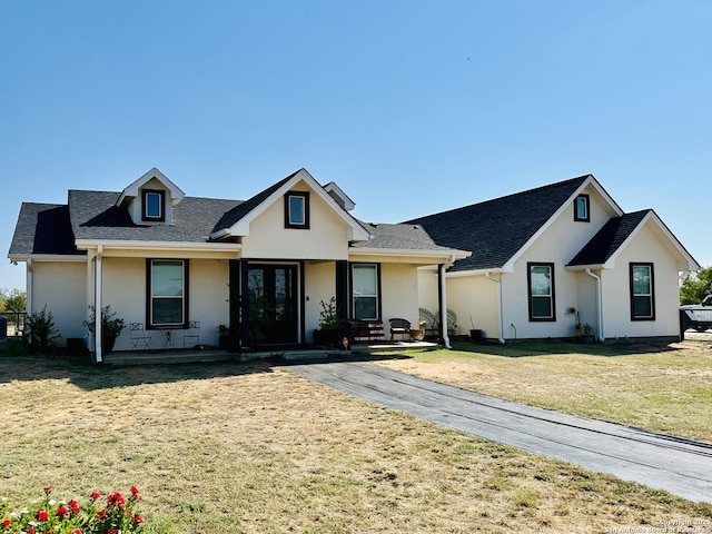 view of front of home featuring a front yard and covered porch