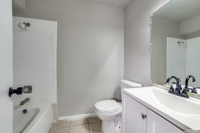 full bathroom with tile patterned flooring, vanity, tiled shower / bath combo, and toilet