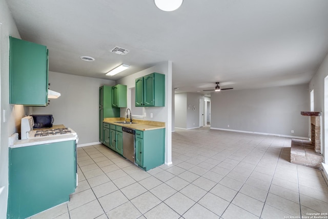 kitchen with dishwasher, sink, green cabinets, light tile patterned floors, and ceiling fan