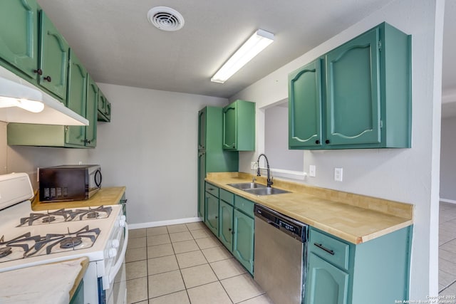 kitchen with sink, stainless steel dishwasher, white gas stove, and green cabinetry