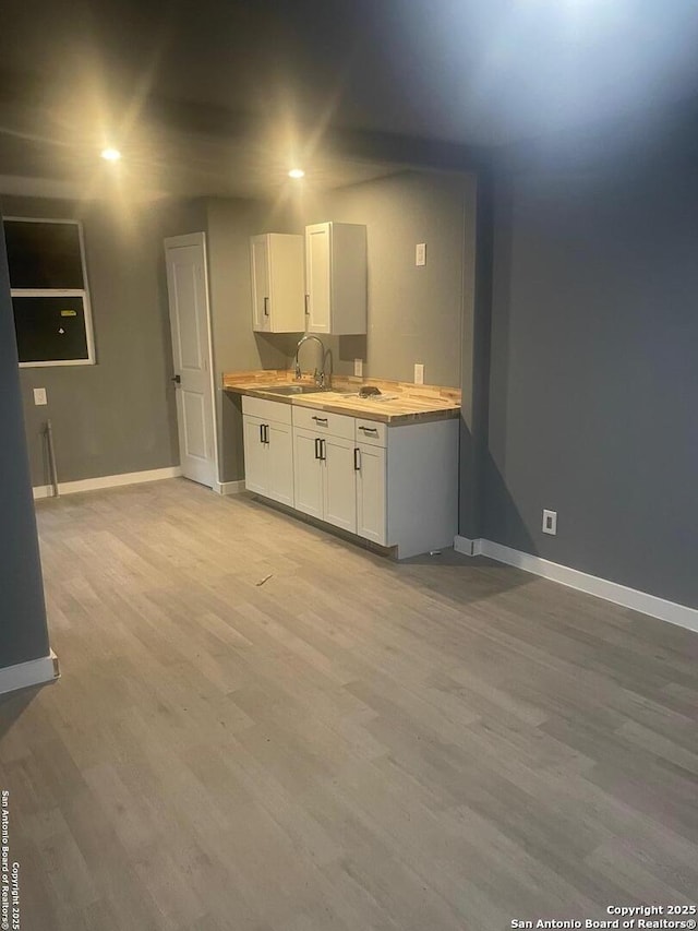 bathroom featuring sink and hardwood / wood-style flooring