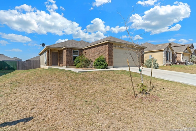 view of front of house featuring a garage and a front lawn