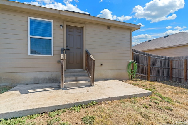 doorway to property with a patio