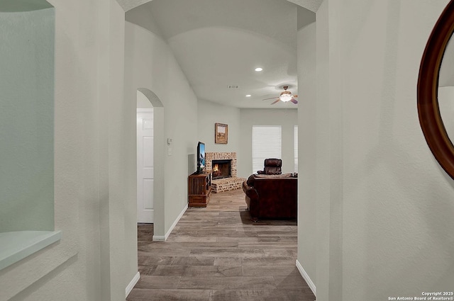 hallway with light hardwood / wood-style floors