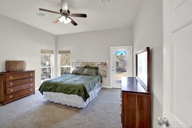 bedroom featuring multiple windows, carpet, access to outside, and ceiling fan