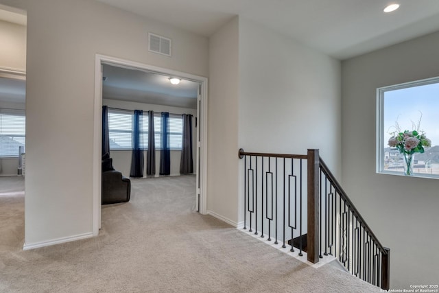 hallway with light carpet