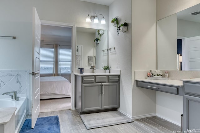 bathroom featuring vanity and a bathtub