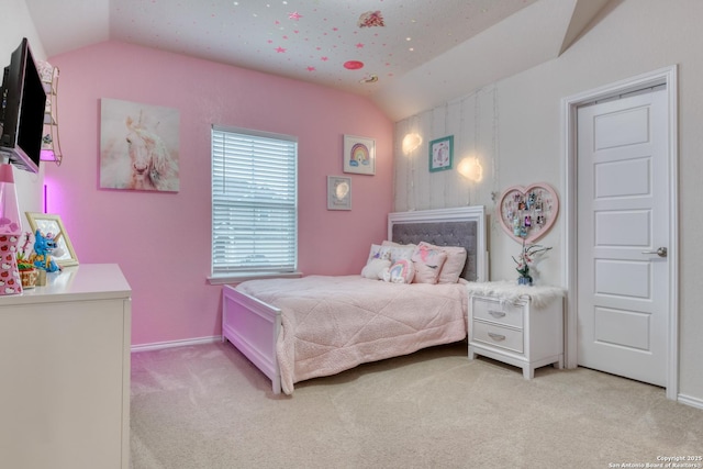 bedroom with light colored carpet and lofted ceiling