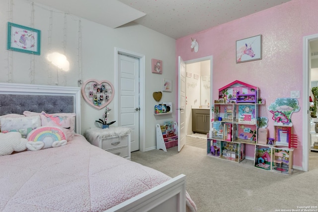 carpeted bedroom with ensuite bath