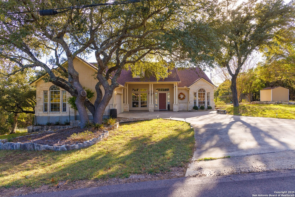 mediterranean / spanish-style house with a front yard