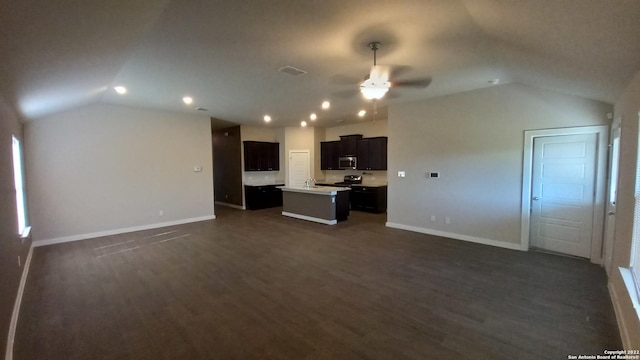 unfurnished living room with dark wood-type flooring, vaulted ceiling, and ceiling fan