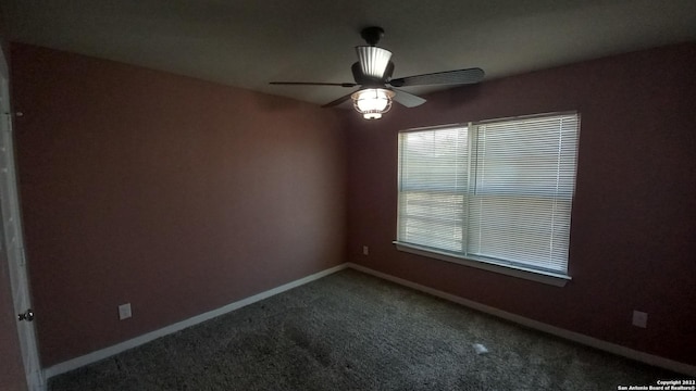 spare room with ceiling fan and carpet flooring