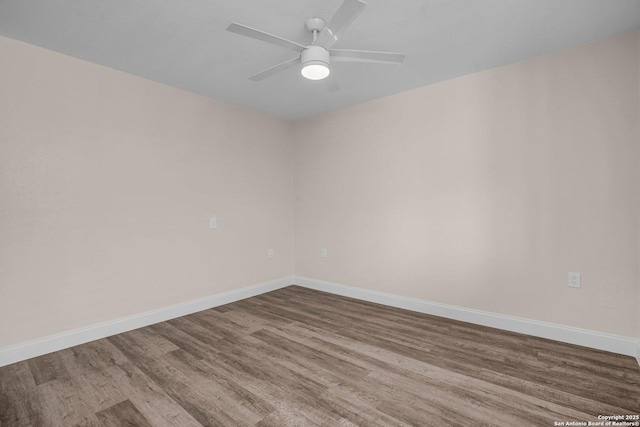 unfurnished room featuring hardwood / wood-style flooring and ceiling fan