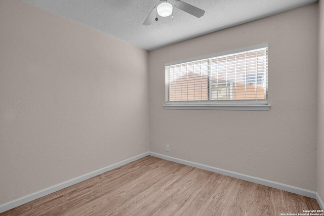 unfurnished room with ceiling fan and light hardwood / wood-style floors