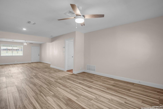 unfurnished room with ceiling fan and light hardwood / wood-style flooring