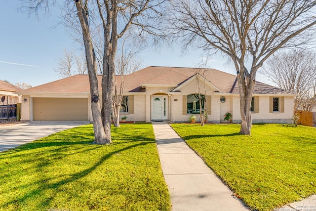 ranch-style house with a garage and a front yard