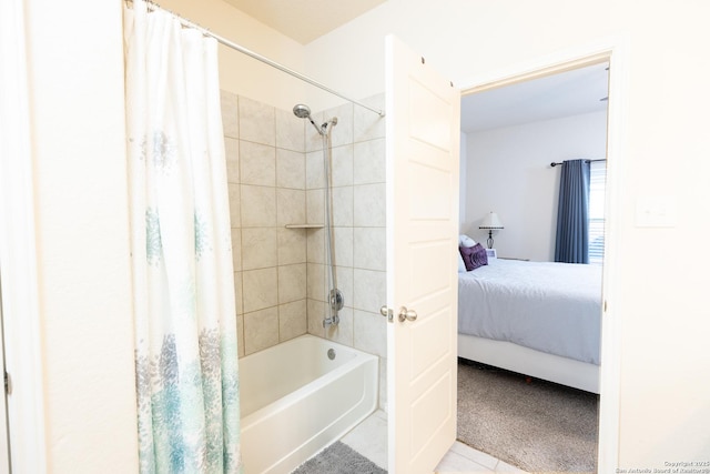 bathroom with shower / tub combo with curtain and tile patterned floors