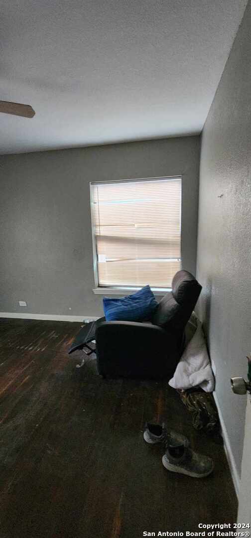 living area featuring dark hardwood / wood-style floors