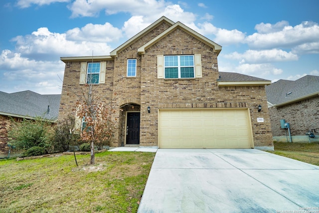 view of front of house with a garage and a front lawn